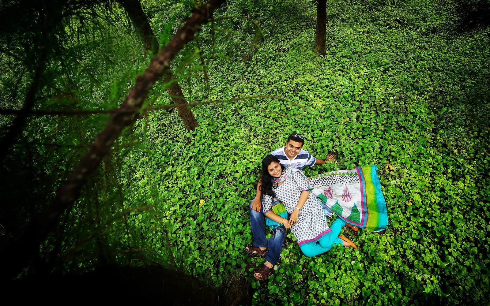  Couples pose in green forest