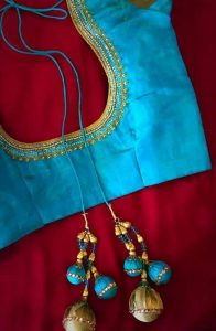 51.Simple blue blouse with three line maggam work