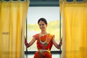 43.Red silk saree with mango and line design