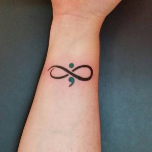 5.Infinity dot and comma tattoo