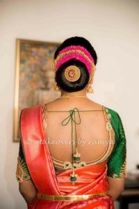 2.Large low bun with red and gold gajra