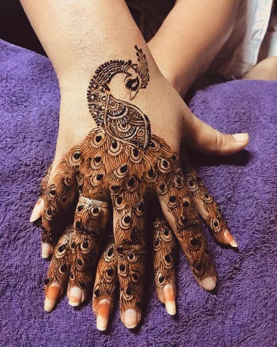 1.Trendy Peacock Back Hand Mehndi 