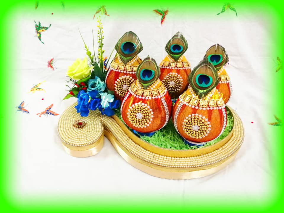 Coconut plate decoration with peacock feather 