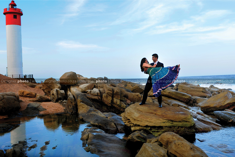 couple portrait near light house