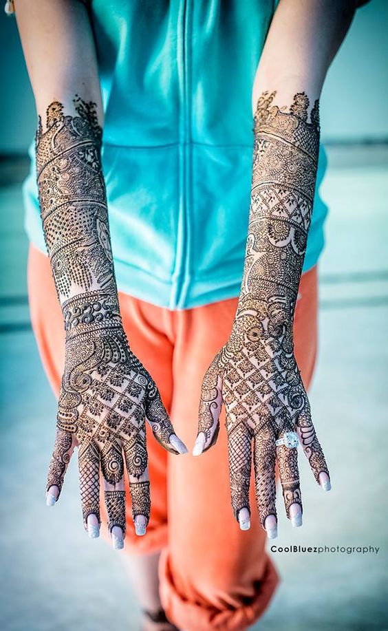 14. Peacock and Checkers back hand bridal mehndi design