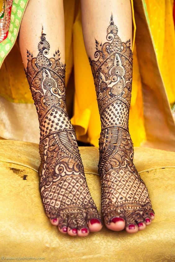 21. Paisley and peacock bridal feet mehndi