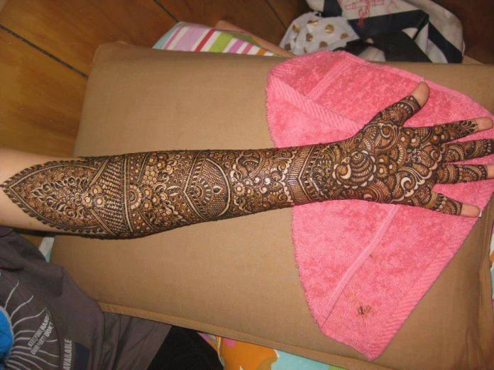 34. Bridal Mehndi with leaves, flowers and fillers
