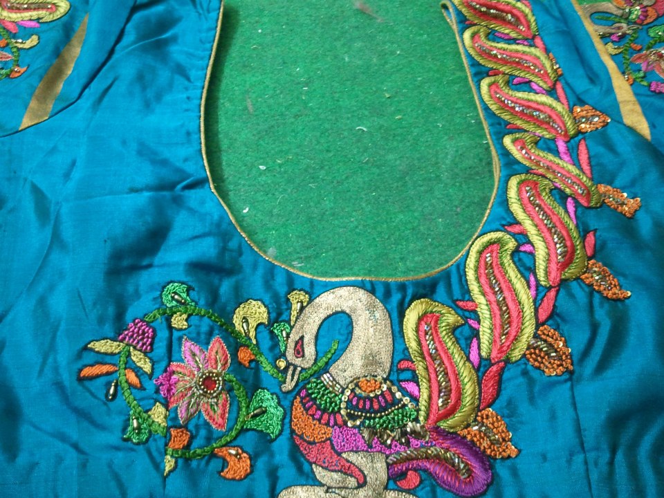 54. Sparkling blue blouse with white duck maggam design