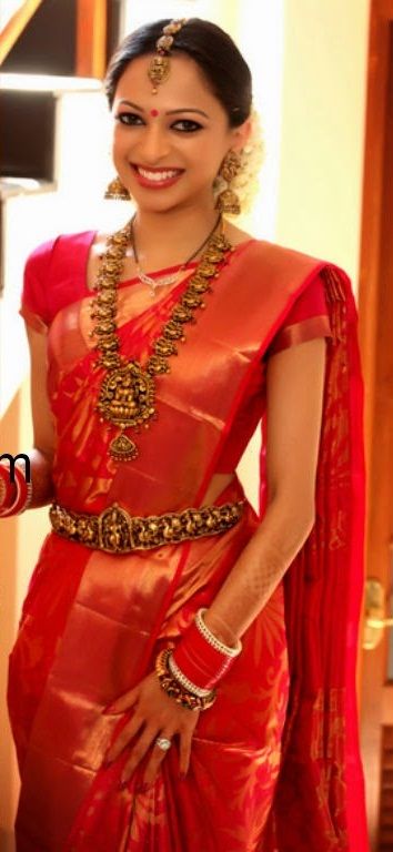 12. Red flower silk saree with golden plain border