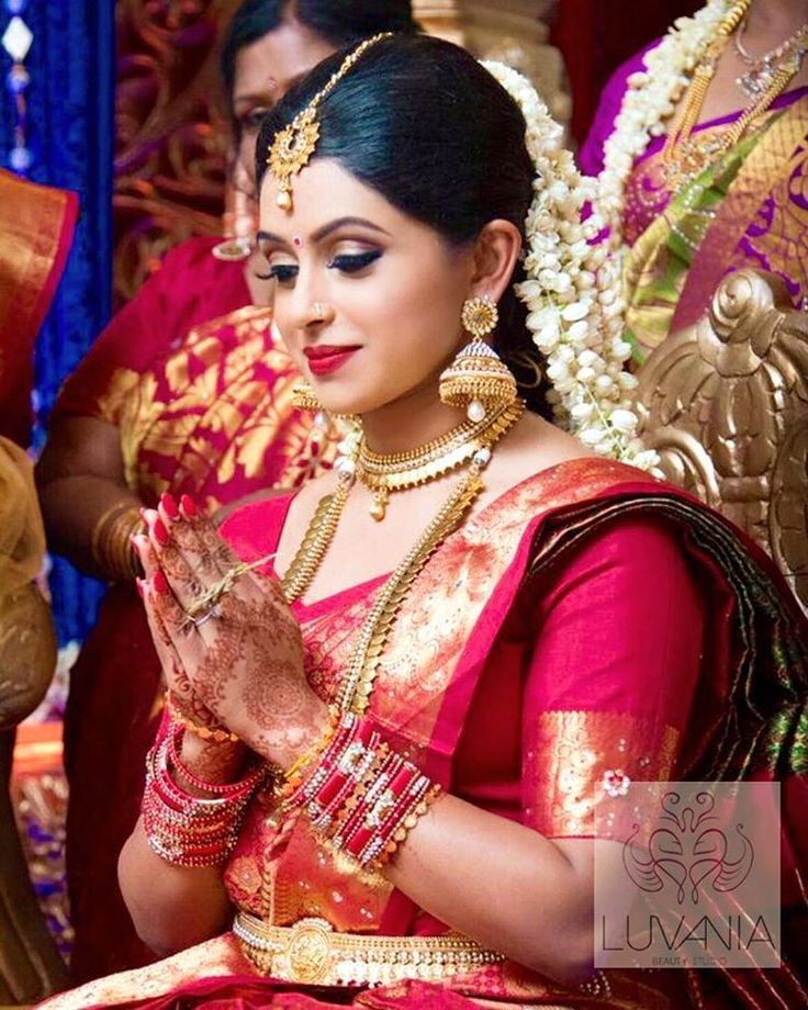 14. Red silk saree with full golden zari design