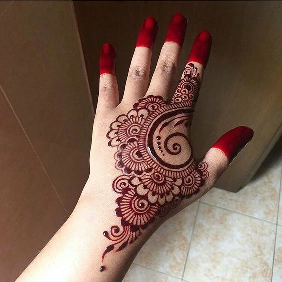 14. Red Mehndi back hand design 