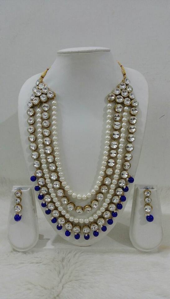 14.White pearl with kundan and blue neck set