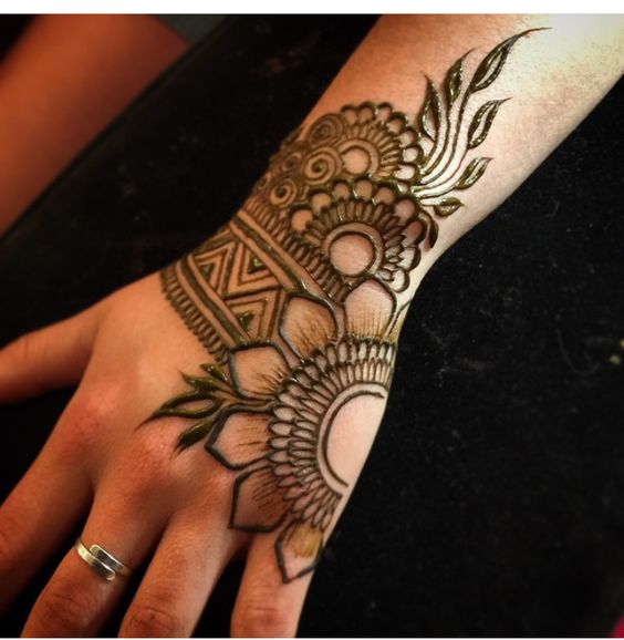 15. Broad henna back hand design