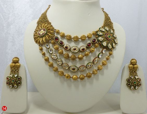 18.Three golden string and two kundan string neck set