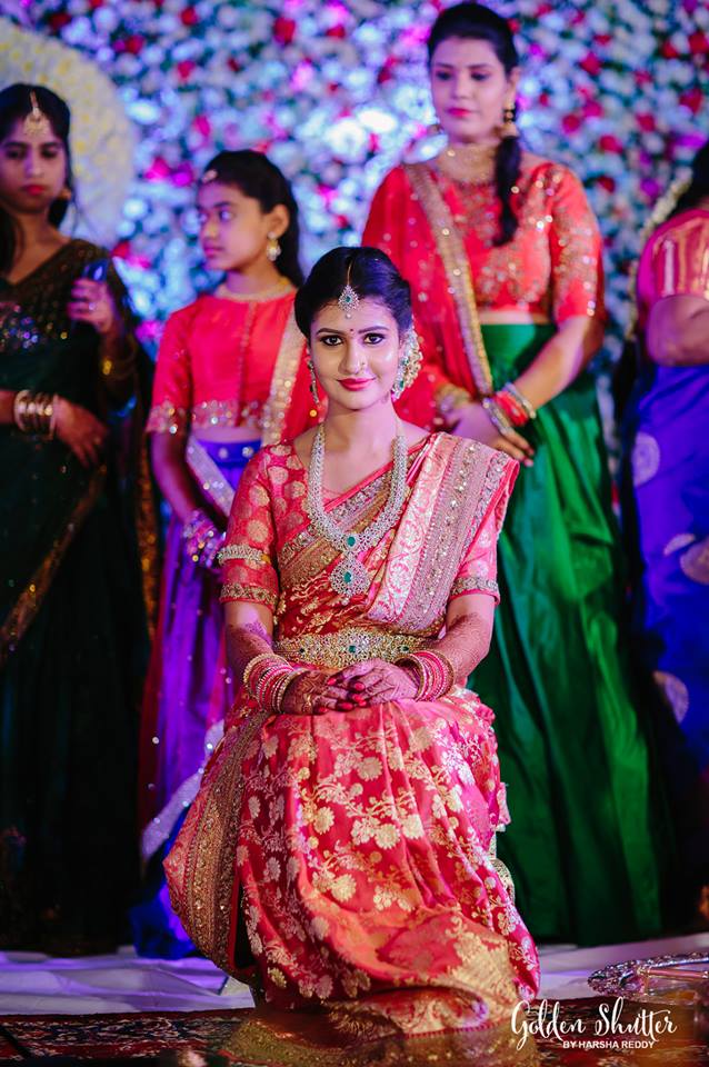 33. Red silk kancipuram saree with flower design