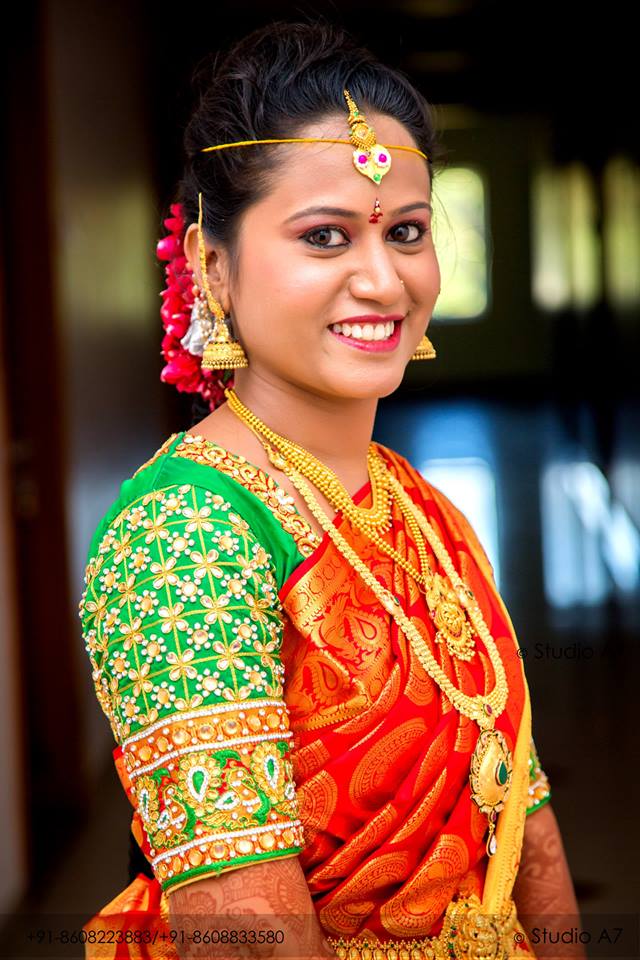 38. Red silk saree with green checked blouse