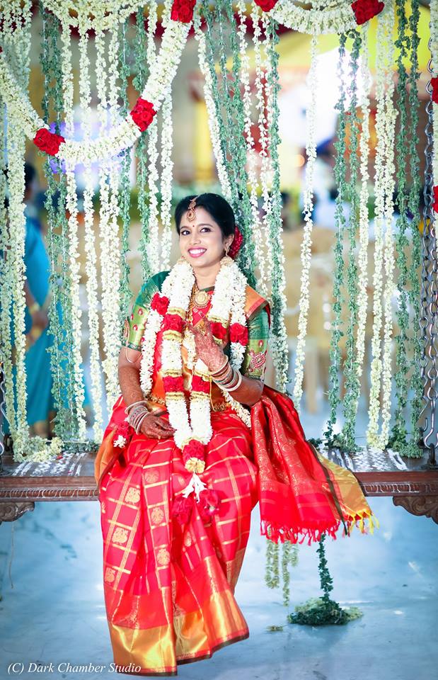 42. Red checked silk saree with peacock design