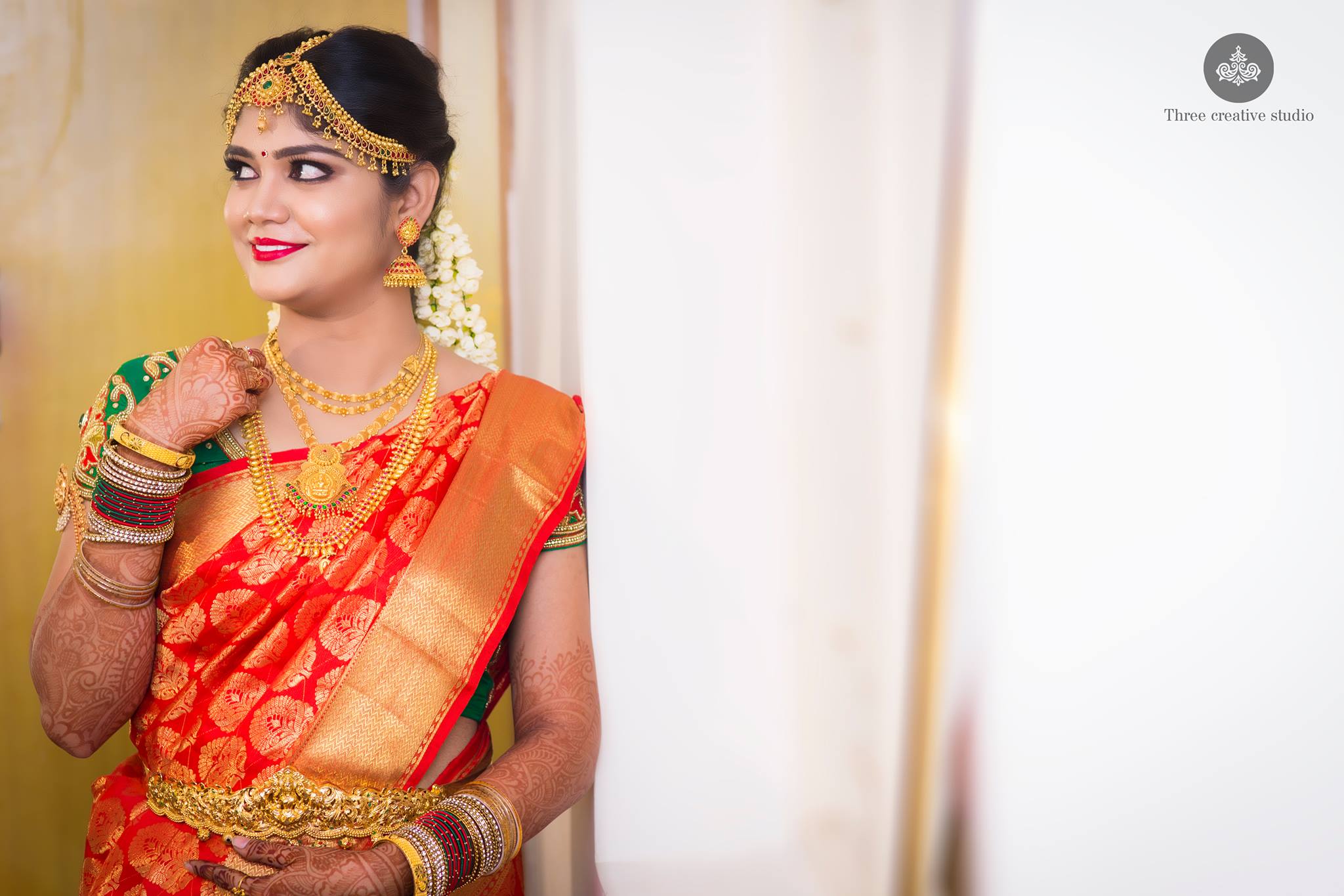 49.Red silk saree with thilagam design and green blouse