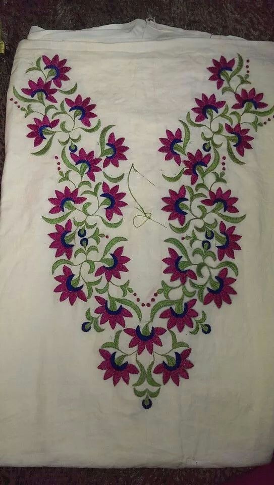 7. White Top with Red Flowers and Green Leaves