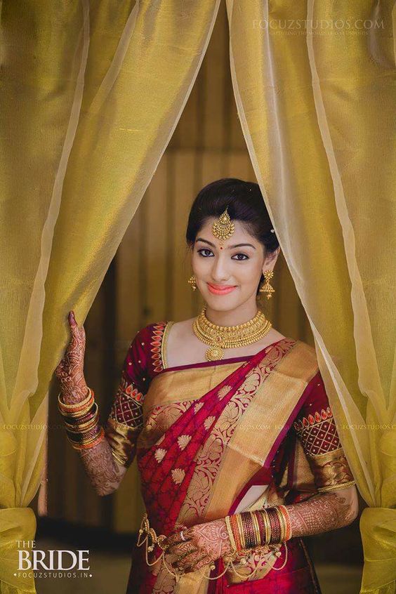 9. Dark Red saree with Golden flower border