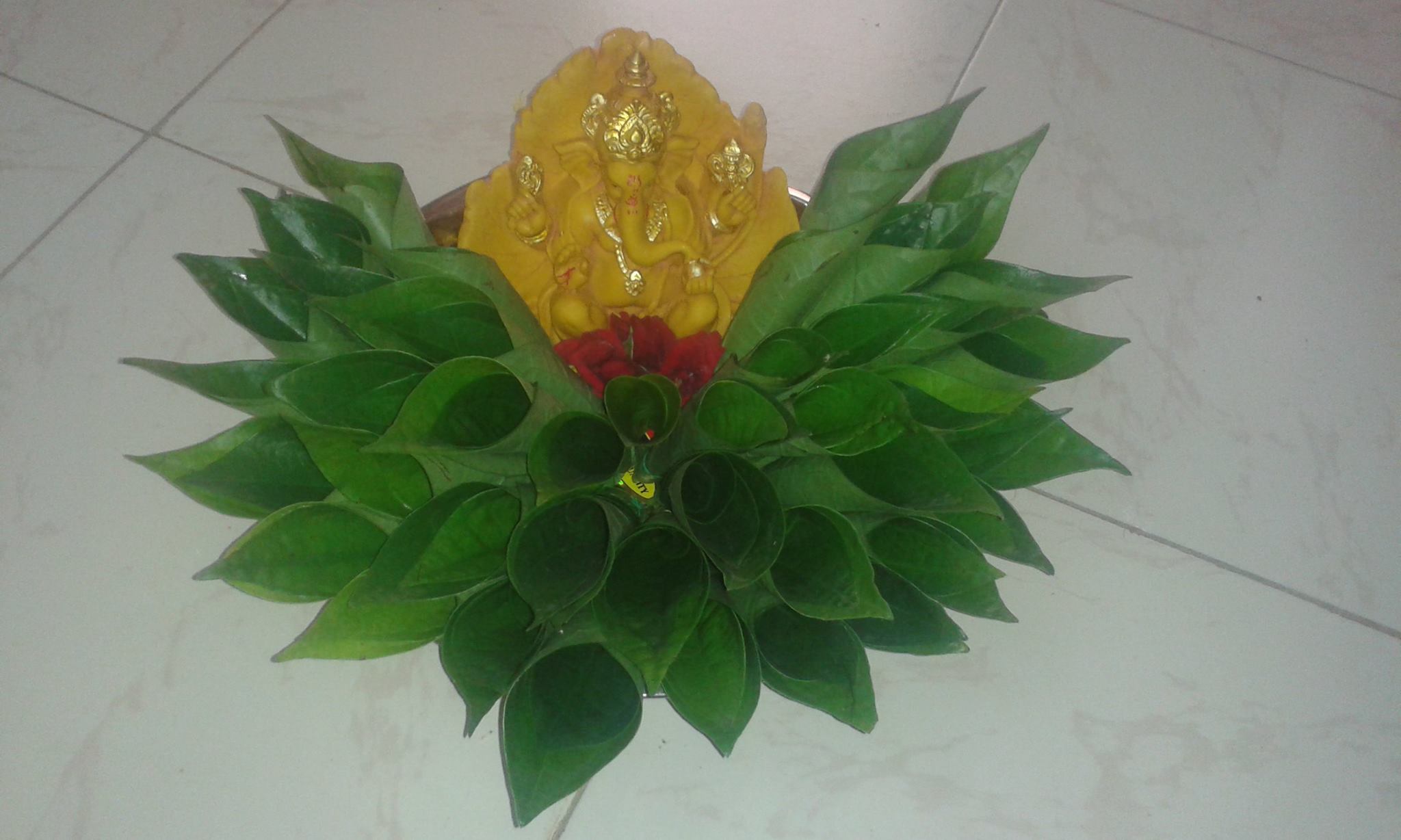 21.Yellow ganesha with betel leaves decoration