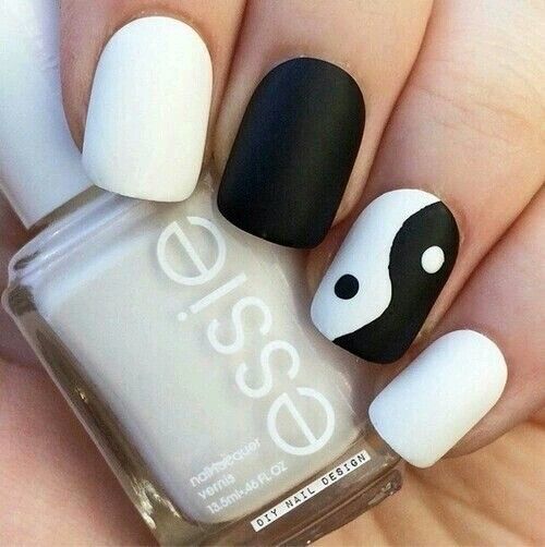 41.Cute white and black nail art 