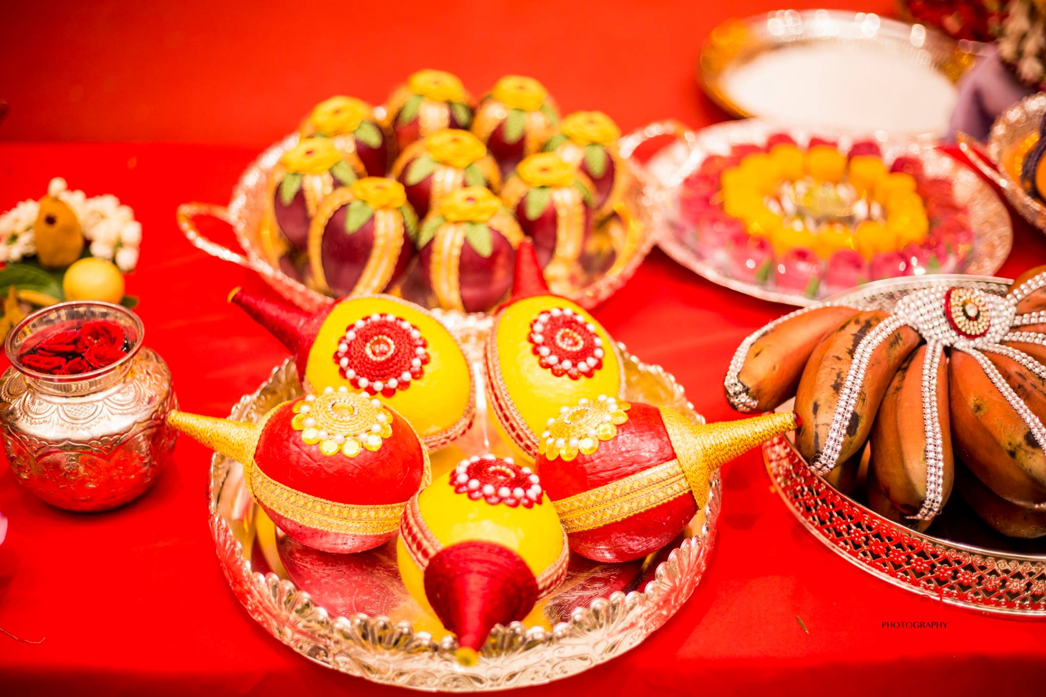 Yellow and red painted Coconuts