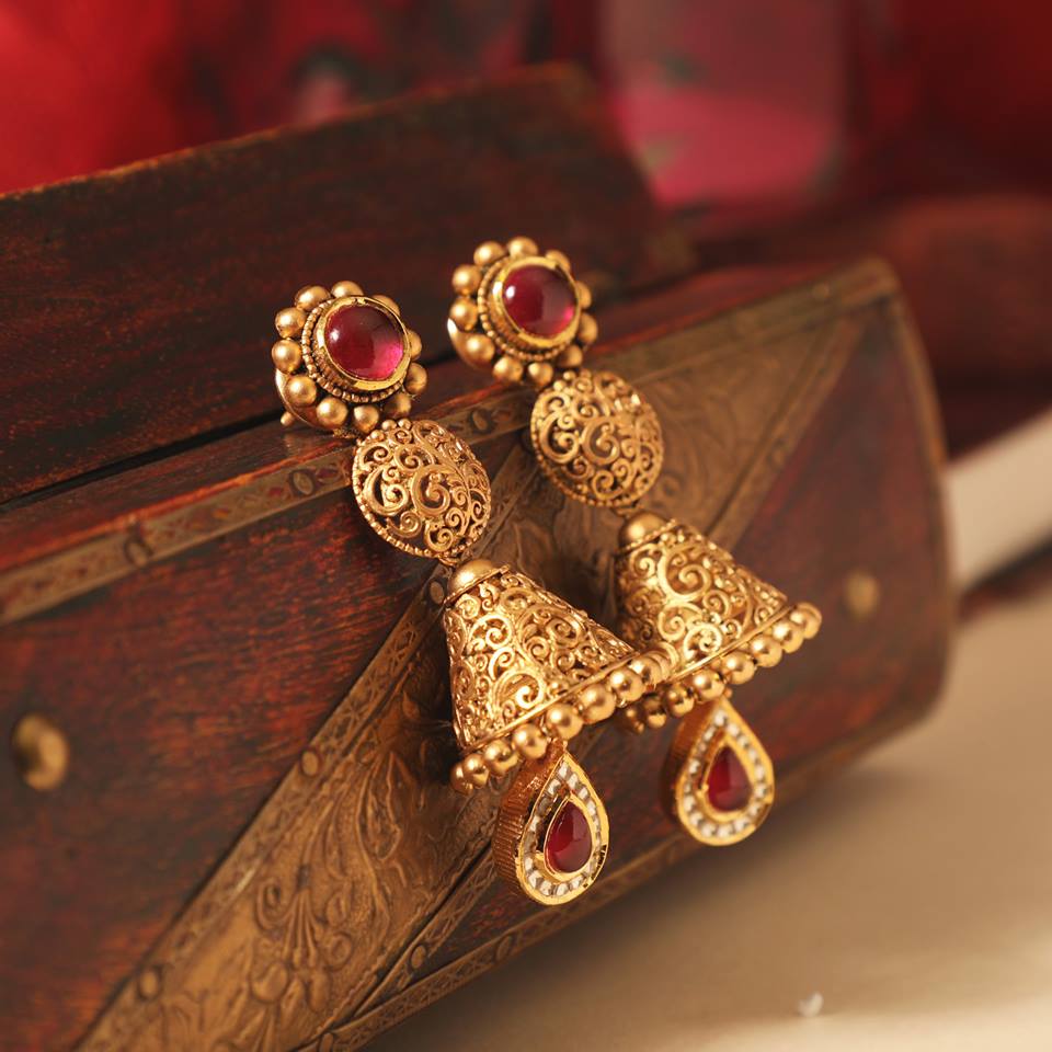 Antique gold with a splash of red ear ring