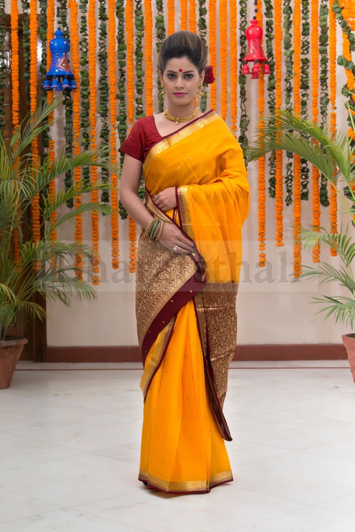 Yellow with maroon border saree