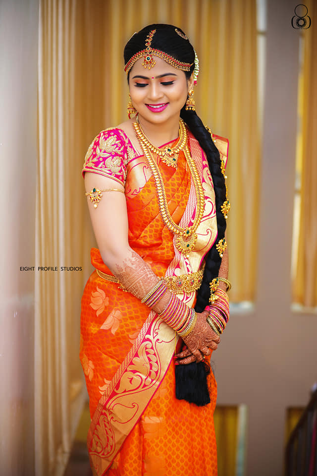 Dazzling Orange silksaree with pink border