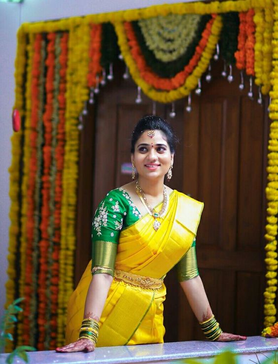 Yellow saree with Green Blouse