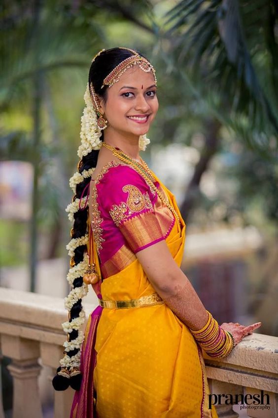 Divine Yellow saree with Pink Aari work blouse 