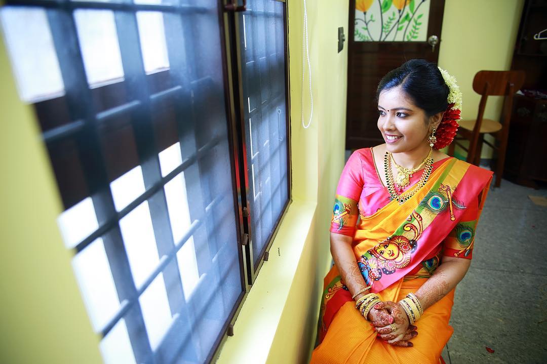 Yellow Silksaree with peacock feather border