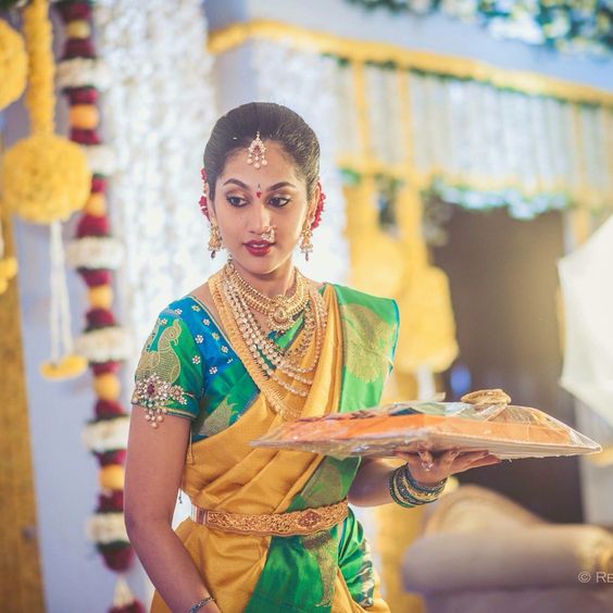 Yellow Saree with blue Green Blouse