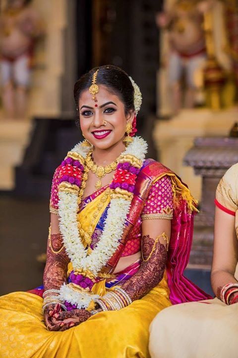 Yellow saree with pink work blouse