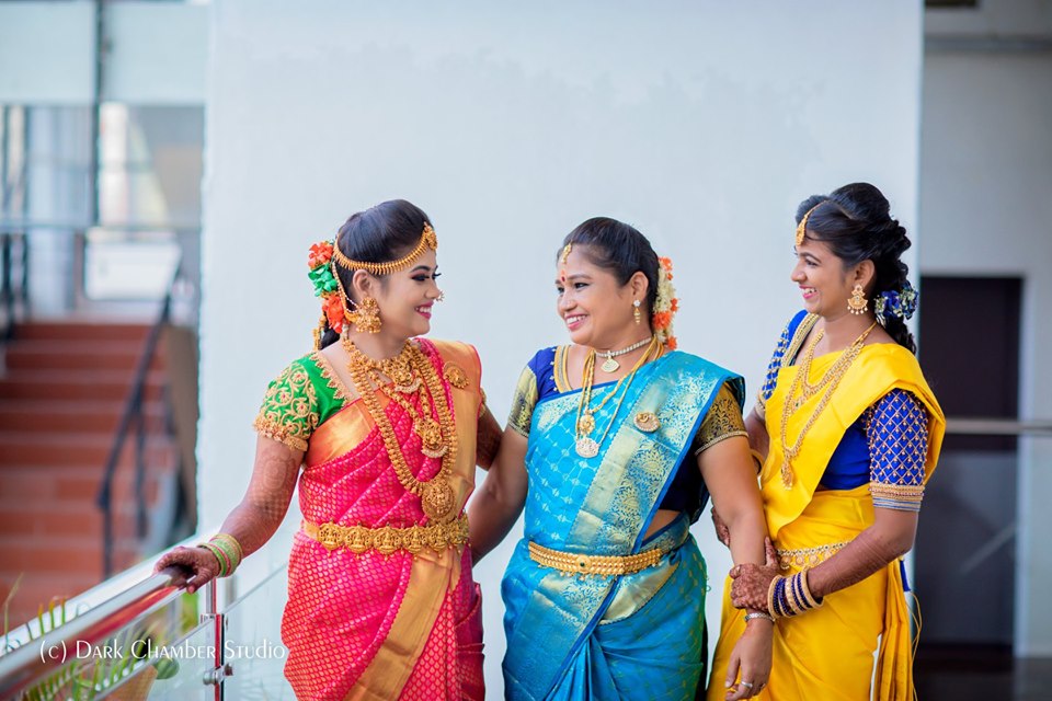 bride with her mom and sis