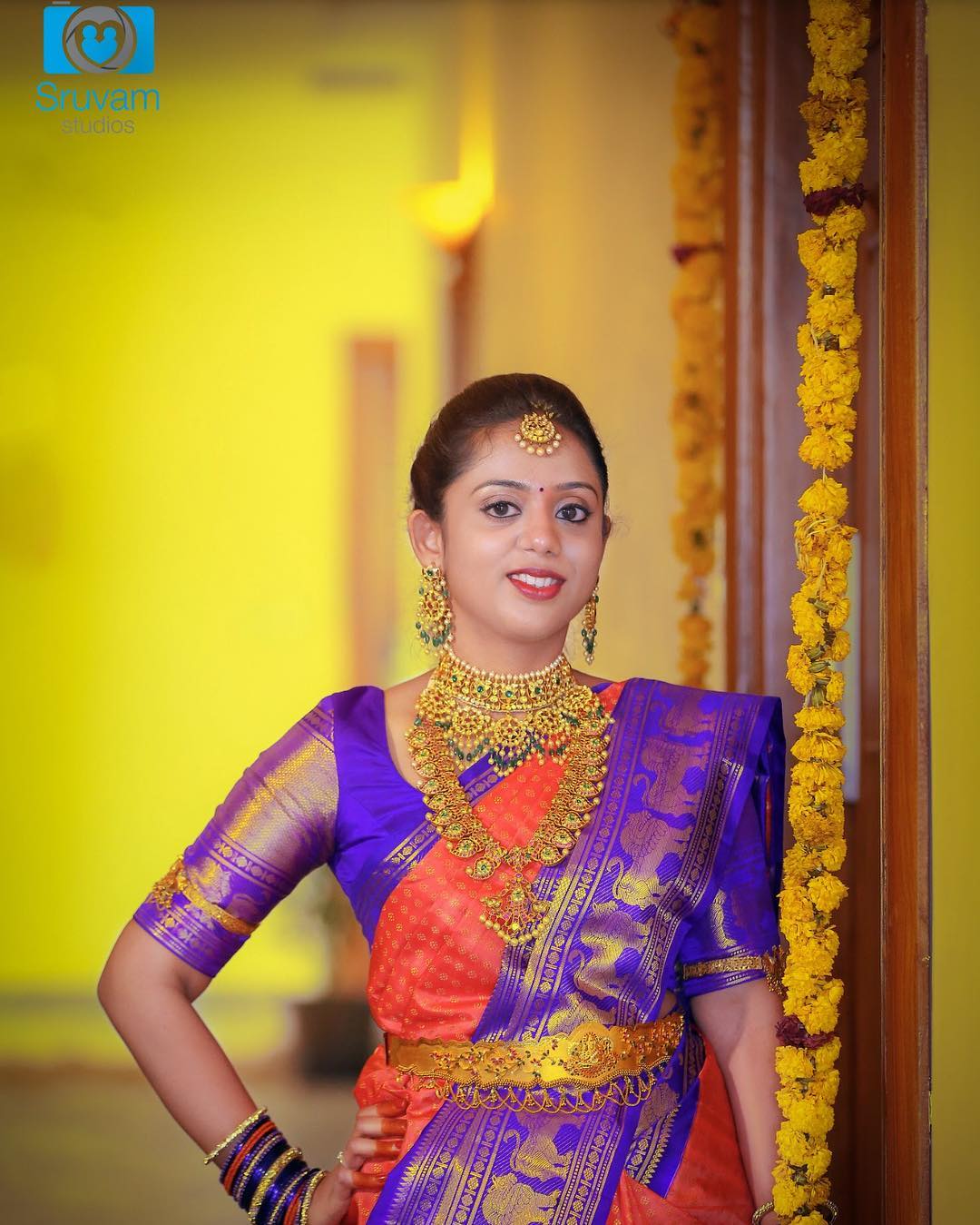 Orange silksaree with Lion border 