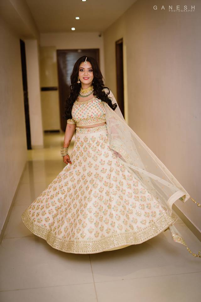 White Lehnga with colorful design 