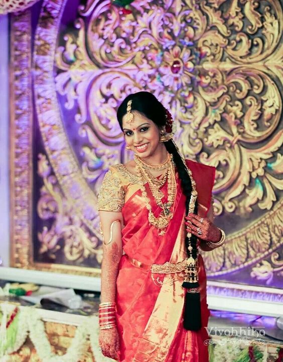 Red saree with gold Blouse