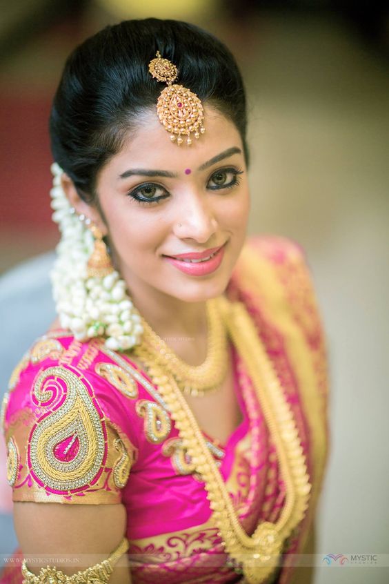 Golden Mango aari work in pink blouse 