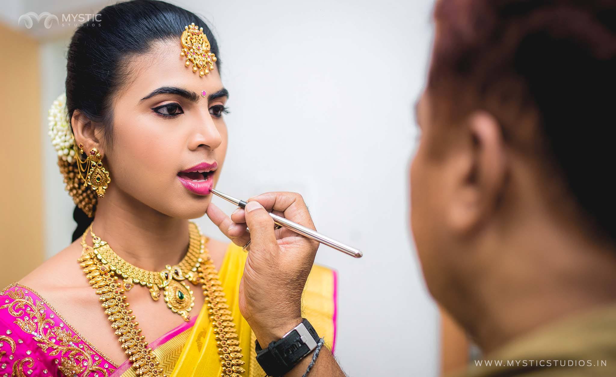 Applying Lipstick for Yellow pink bride